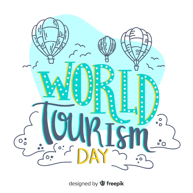 World tourism day lettering with air balloons