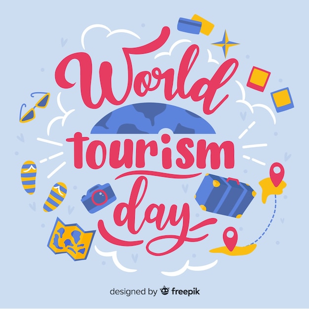 World tourism day lettering with travel objects