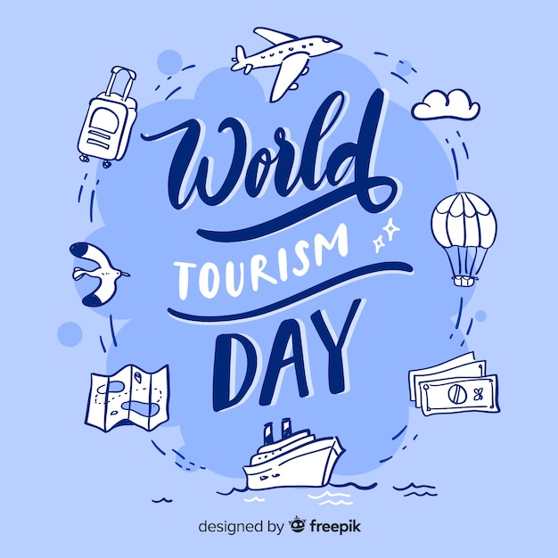 World tourism day with travel items lettering