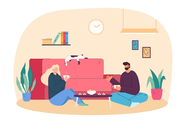 Young couple eating cookies with tea in comfortable living room. Romantic talk of adult woman and man sitting on floor near home sofa and enjoying food flat vector illustration. Hygge, love concept