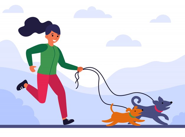 Young woman running and walking dogs