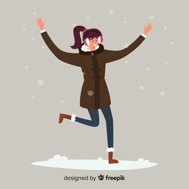 Young woman wearing winter clothes and jumping