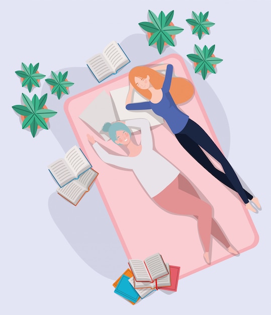 Young women relaxing in mattress in the bedroom