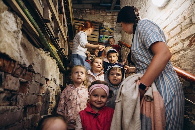 070722 Irpin Ukraine evacuation of children during the Russian war against Ukraine The family is hiding in the dungeon from air strikes