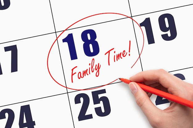 18th day of the month Hand writing text FAMILY TIME and circling the calendar date