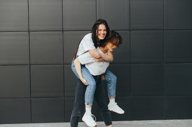 2 girls in casual clothes having fun