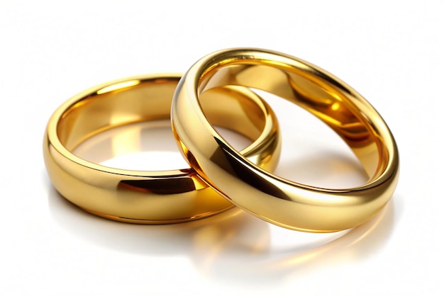 2 gold wedding rings on white background