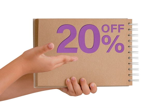 20 percent discount on isolate Notepad from recycled paper in the hands of a child with text sale up to 20 percent The child is holding a notepad demonstrating a big sale