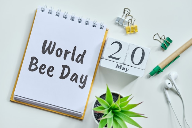 20 twentieth World Bee day May Month Calendar Concept on Wooden Blocks.