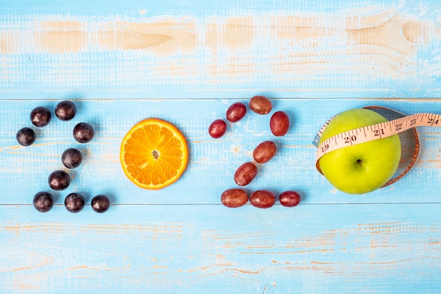 2020 Happy New Year and New You with fruits Red  backgrounds