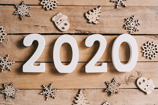 Photo 2020 new year concept on wood table and christmas decoration background.