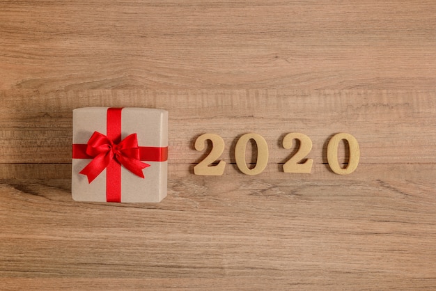 2020 Wood numbers for new year with gift box