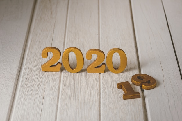 2020 Wooden gold number. Happy New Year on nature concept