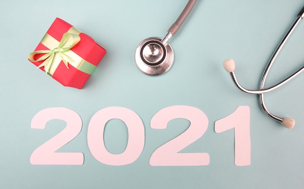 2021 number with stethoscope and Gift box. Concept Happy New Year.