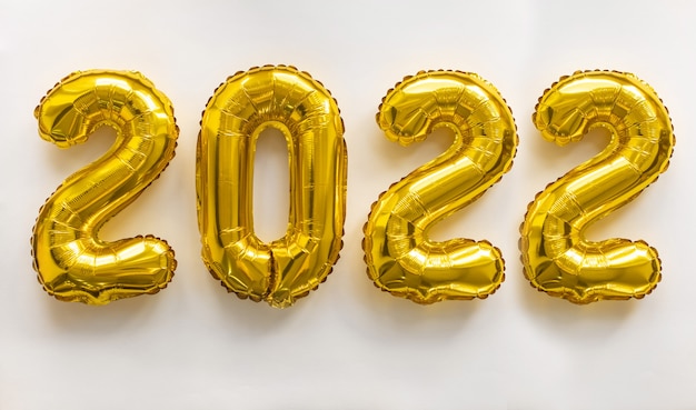 2022 gold numbers inflatable figures numbers on white background. The concept of New Year and Christmas