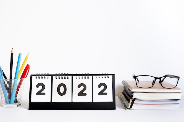 2022 new year goalplanaction concepts with text and accessories on desk