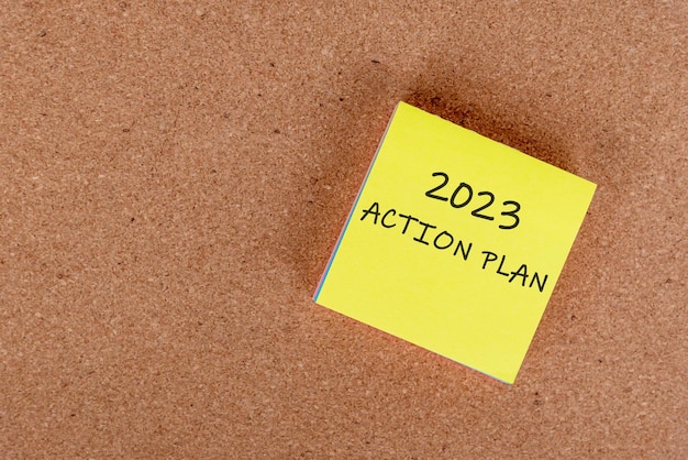 2023 action plan on yellow adhesive note