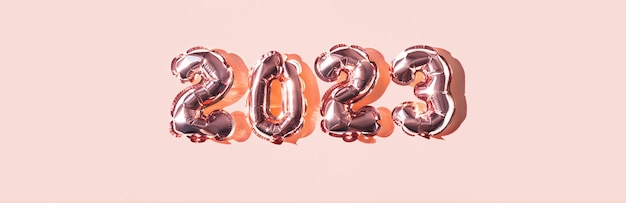 2023 numbers made from foil pink balloons New year concept