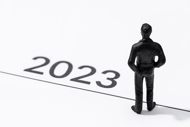 2023 year start concept Figurine on start line looking to the future