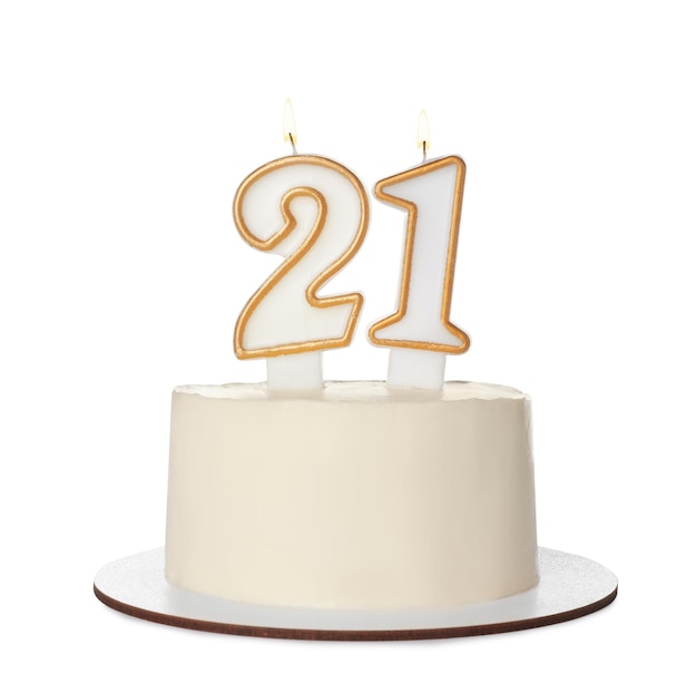 21st birthday Delicious cake with number shaped candles for coming of age party isolated on white