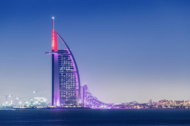 23 February 2021 Dubai UAE Burj Al Arab illuminated hotel at night time Travel destinations and vacation in Dubai