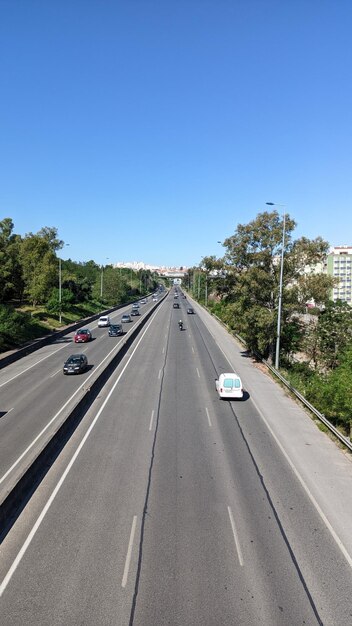 3 lanes in one direction and 3 in the other wide autobahn in Lisbon on the outskirts of the city