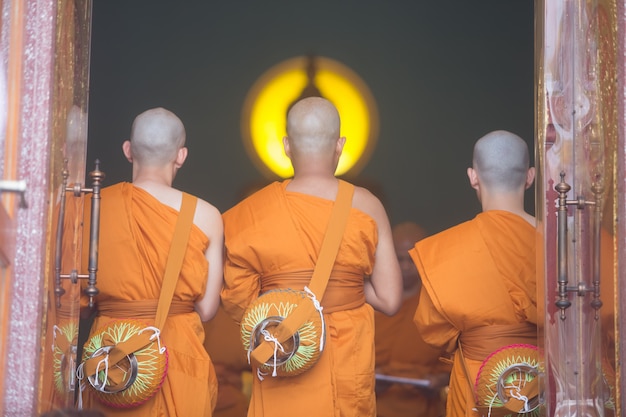 3 monks standing in prayer in the church