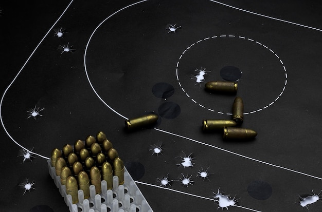 35 mm caliber parabelum bullets on a target with bullet holes