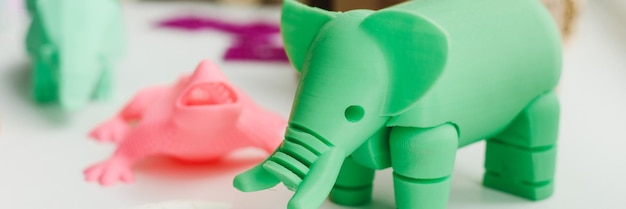 3D figures printed on an elephant lizard and snail printer 3d toys for children Web banner