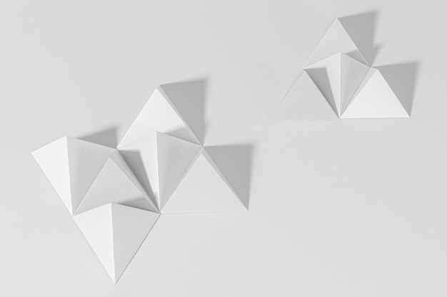 3D gray pyramid paper craft on a gray background