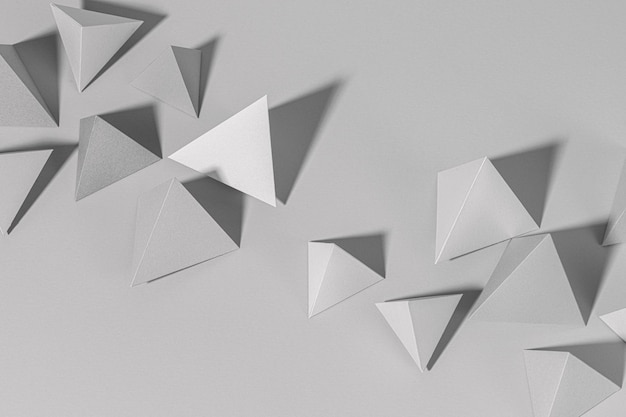 3D gray pyramid paper craft on a gray background