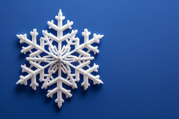 3d illustration snowflake pattern against soft blue colored background