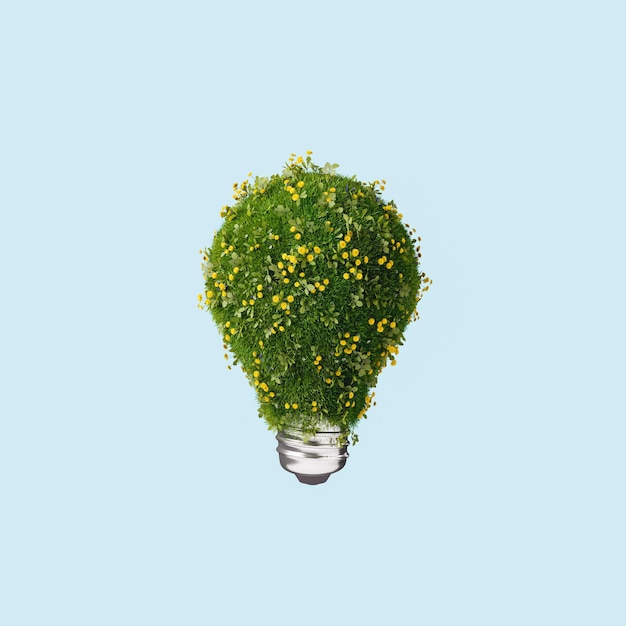 3D rendering of light bulb covered with grass