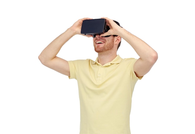 3d technology, virtual reality, entertainment and people concept - happy young man with virtual reality headset or 3d glasses