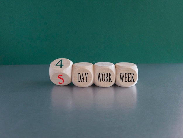 4 or 5 day work week symbol Turned cubes and changes words 5 day work week to 4 day work week