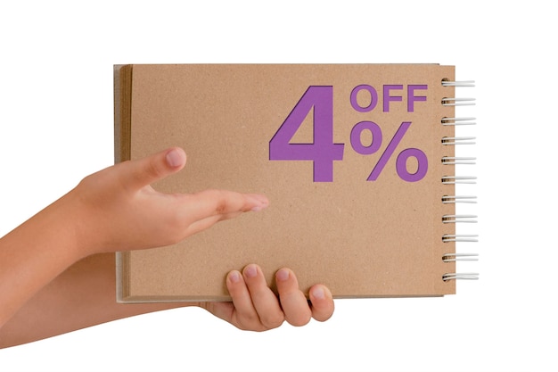 4 percent discount on isolate Notepad from recycled paper in the hands of a child with text sale up to 4 percent The child is holding a notepad demonstrating a big sale