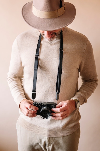 45 year old man with modern digital camera