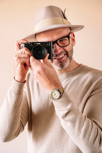 45 year old man with modern digital camera