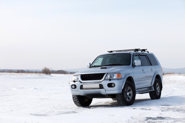 4wd car on the ice of frozen lake