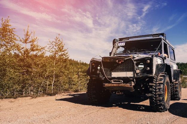 4x4 jeep SUV car stands at the start before an offroad race