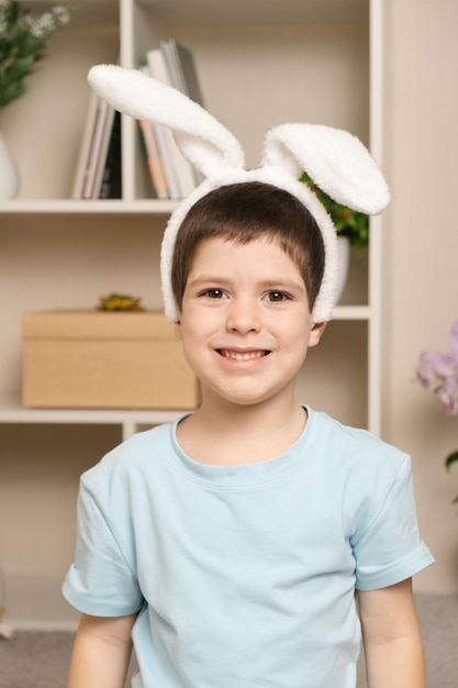 A 5 old preschool boy with rabbit ears on his head