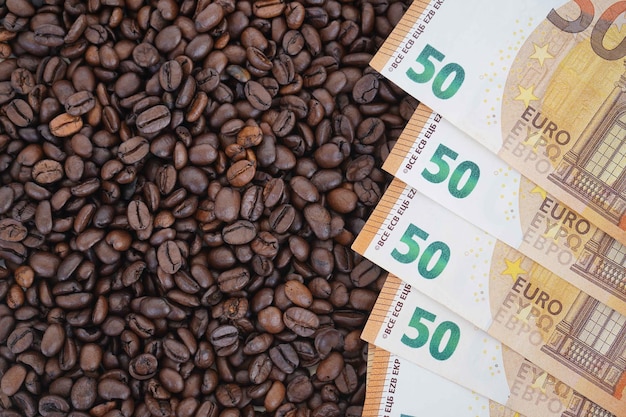 The 50 euro bills are on roasted coffee beans The concept of rising food prices the global food crisis