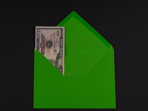 50 US dollar in an green envelope