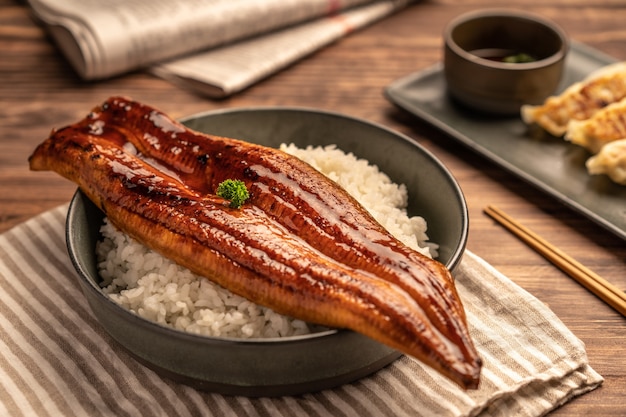 Ã Â¹ÂClose-up Japanese grilled eel served over rice or Unagi don set on plate. Japanese food on restaurant table