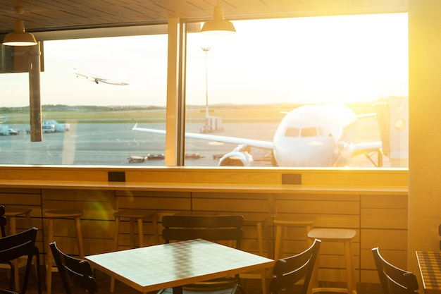 Aairport outside the window scene waiting for the flight Parked aircraft on airport through the gate window