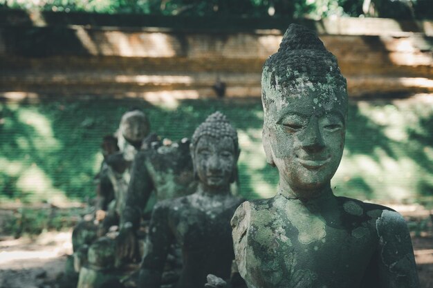 Abandon broken Buddha sculpture in temple