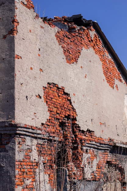 An abandoned brick building in a ruined state