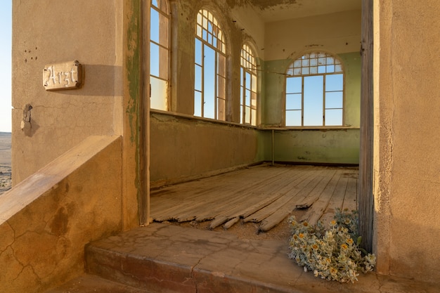 Abandoned building in Kolmanskop ghost town near Luderitz in Namibia.