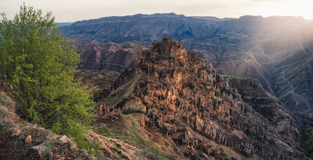 Abandoned ethnic village on the top of a mountain. The old abandoned ghost town of Gamsutl, Dagestan, Russia. Panoramic view.