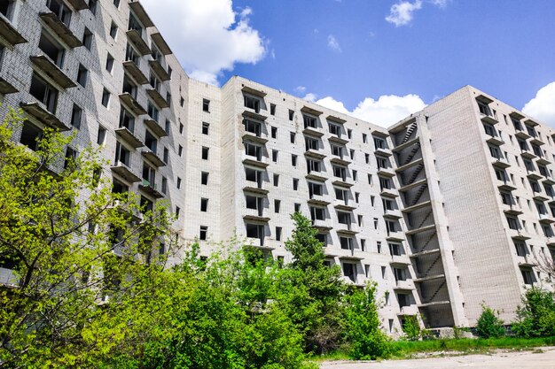 Abandoned high-rise buildings, city. Clean quarts and buildings without windows or doors.